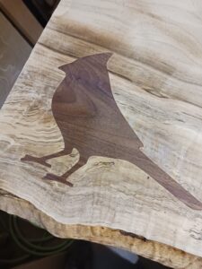 custom wooden carved table with bird