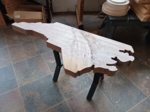 Custom wooden carved table shaped like NC