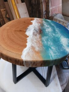 wooden carved table top with ocean pattern